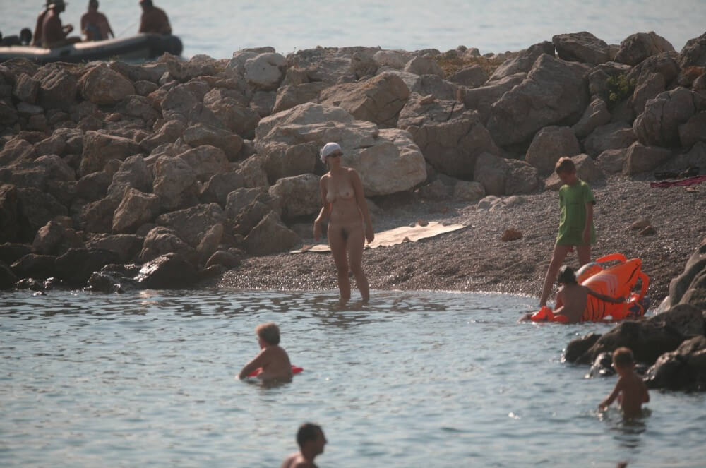 FKK cove pyramid in waters - The practice of nudism promotes freedom from fears and insecurities