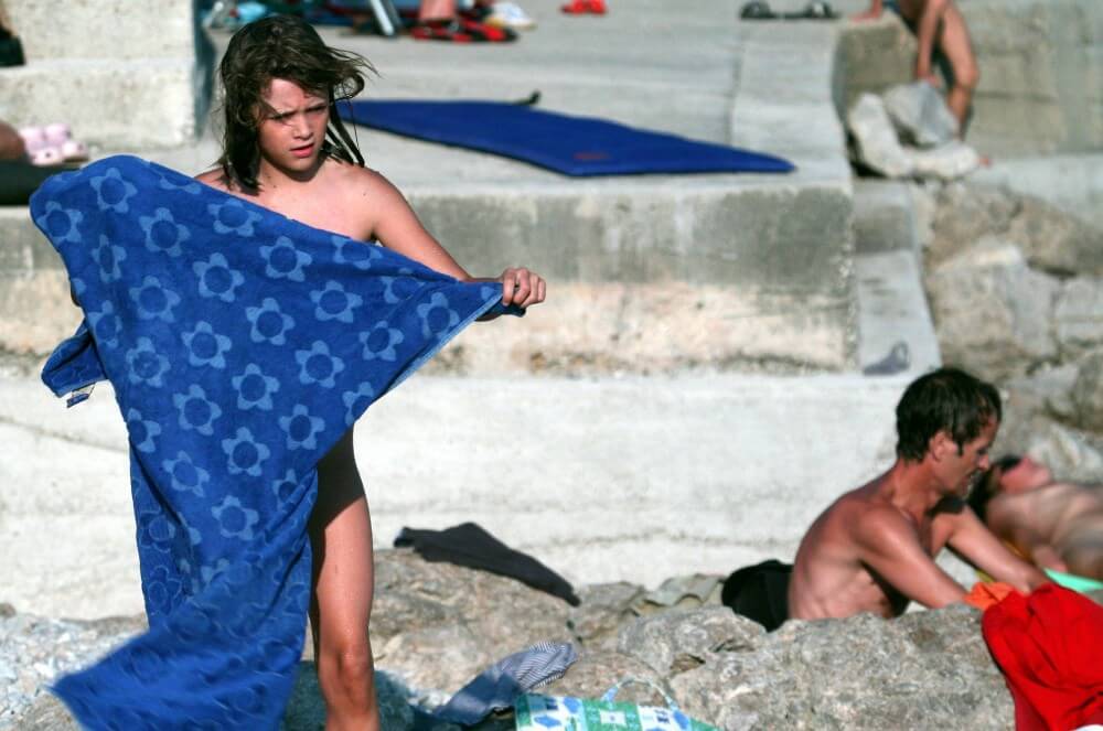 Nudist Rocky Family Angle - In nudism, people are equal to one another
