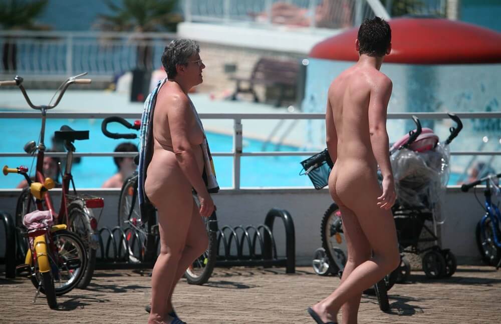 Sun-Soaked Sidewalk pics - Nudism is part of life