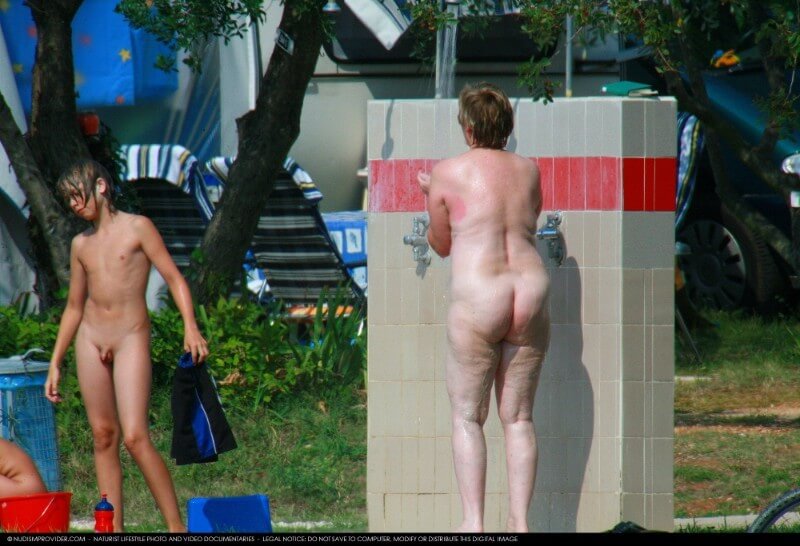 Covered in Towel Nudists-Boardwalk Biking - Harmony and balance are important in this nudist culture