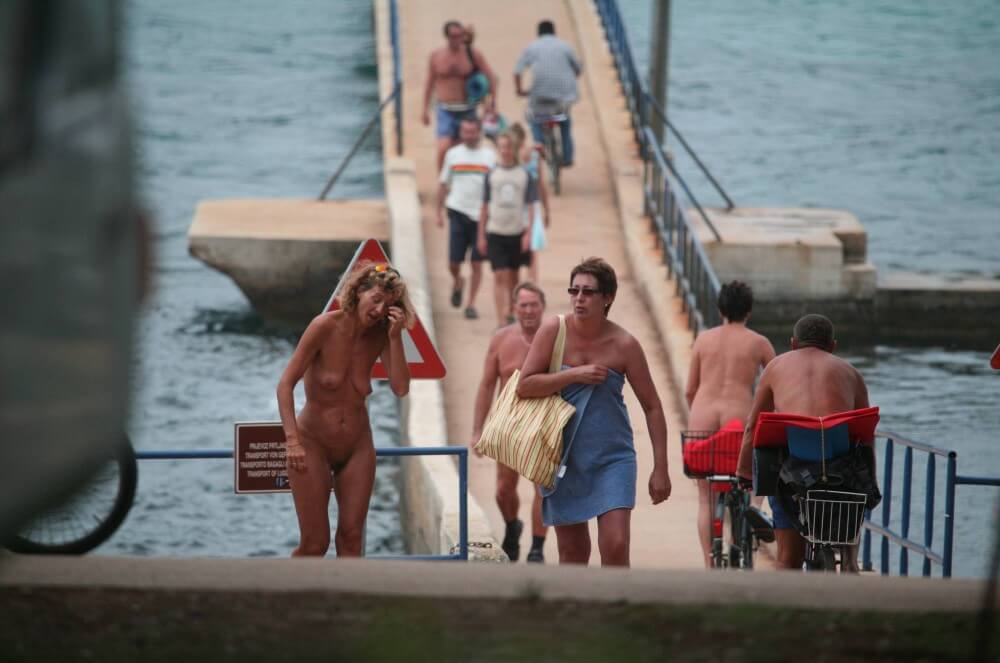 Crete FKK Bridge Crossing photos - The practice of nudism fosters trust and honesty