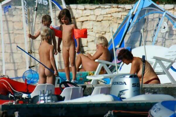By the boat photos - Nudity is perceived as a natural way of life