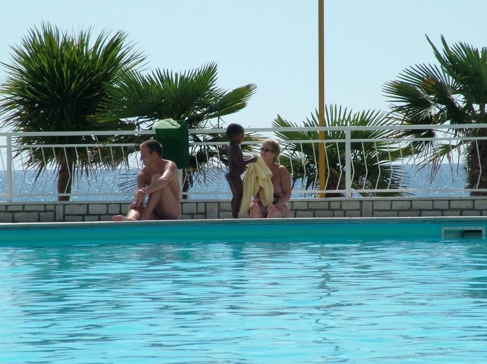 Photo of naturists in an outdoor pool - Mutual respect is an important part of the naturist community
