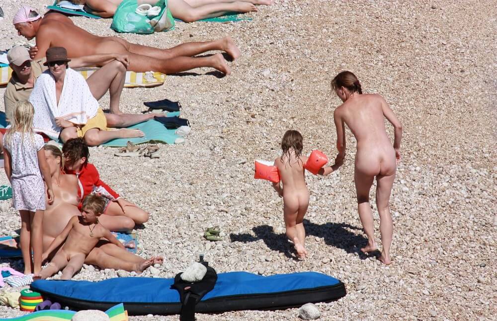 Orange Floaty Safety First Naturist pics - Naturism implies a life free of unnecessary problems